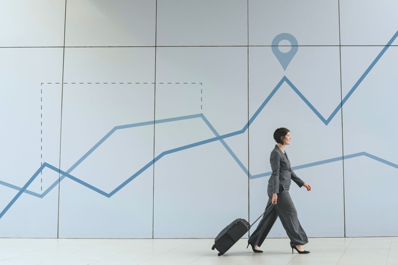 Business woman with a suitcase at the airport