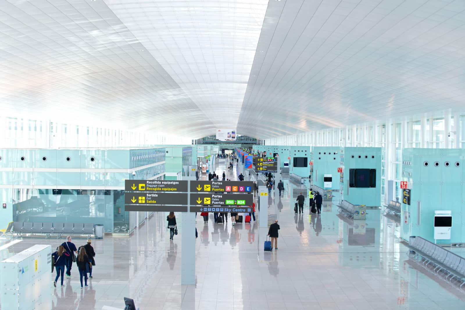 People walking in the airside departure lounge at Josep Tarradellas airport